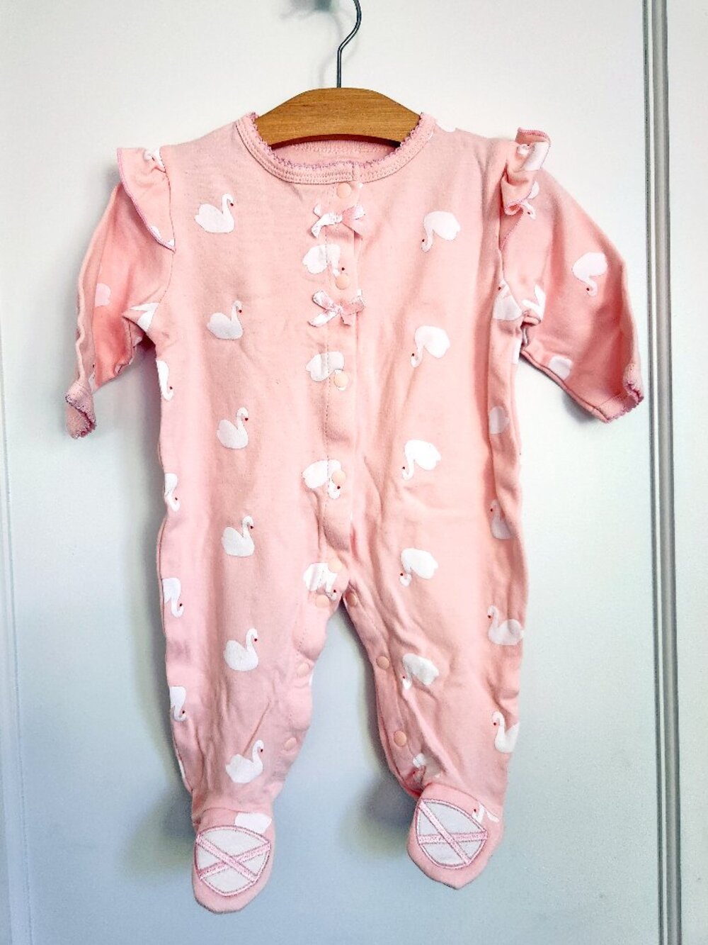 Swan print footed sleeper with ruffles & ballet slipper feet (light pink)